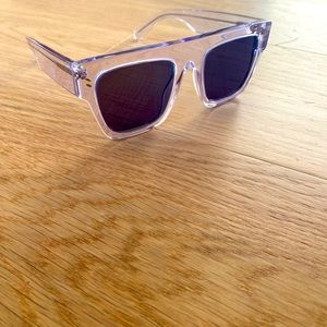 Stella Mccartney sunglasses with blue lenses.